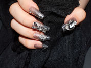 black with nude nails, playboy bunny nail charms, cross nail charms, long press on coffin nails, monoschic