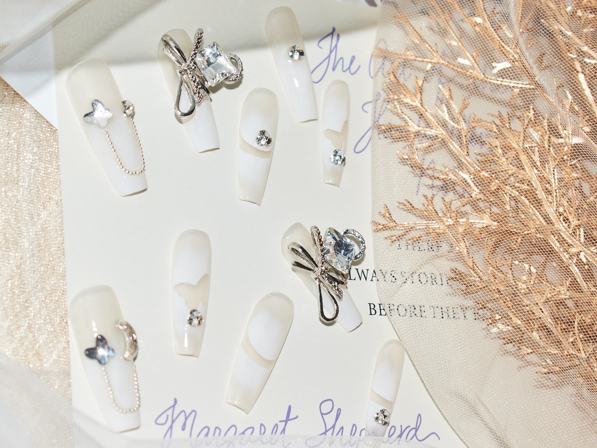 press on french nails, white gel nails, white french tip nails with diamonds, monoschic nails