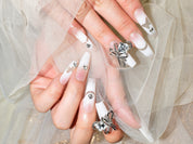 press on french nails, white gel nails, white french tip nails with diamonds, monoschic nails