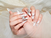 press on french nails, white gel nails, white french tip nails with diamonds, monoschic nails