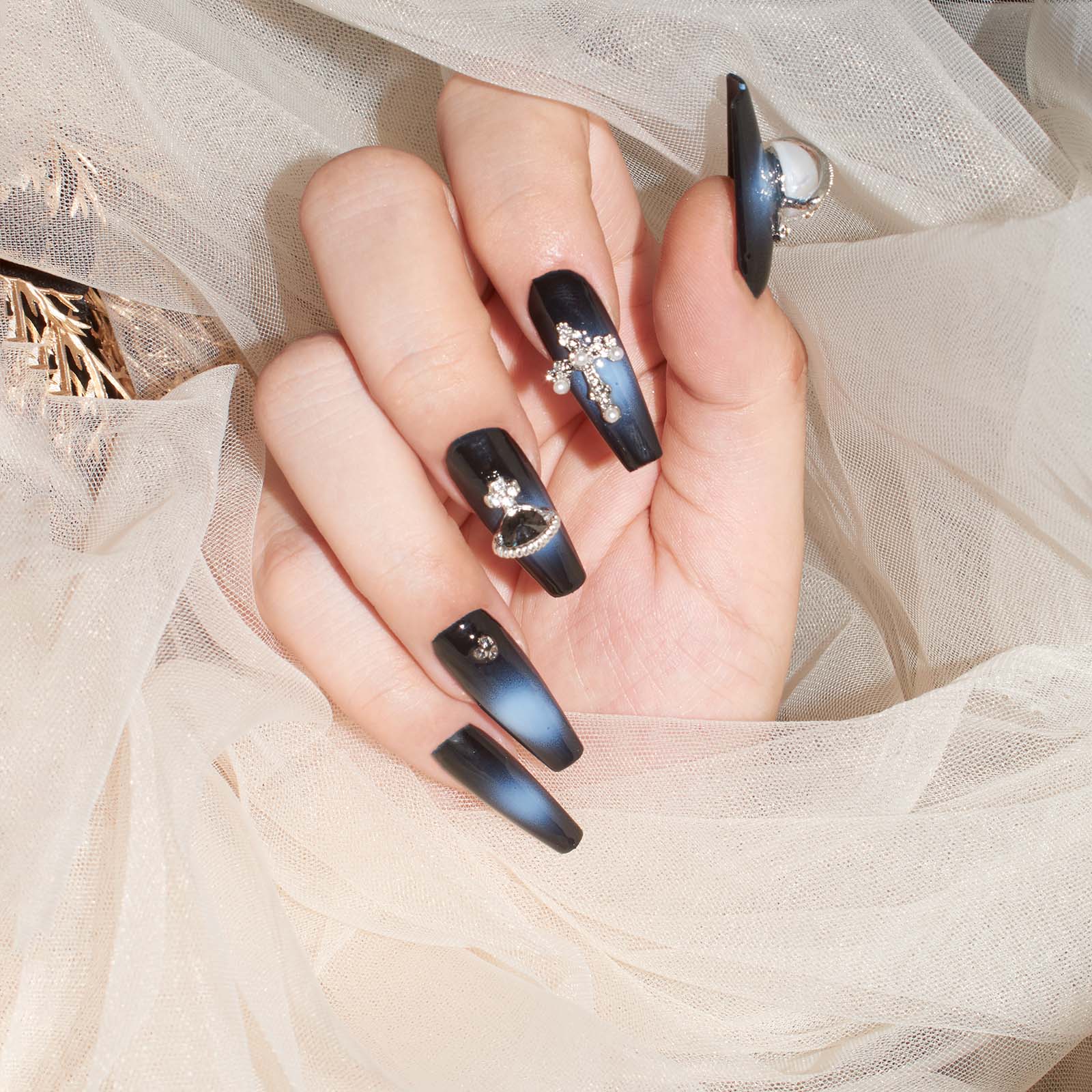 Black to navy gradient coffin-shaped press-on nails with 3D crosses, pearls, and rhinestones