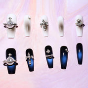 Set of white and navy coffin-shaped press-on nails with 3D crosses, pearls, and rhinestones