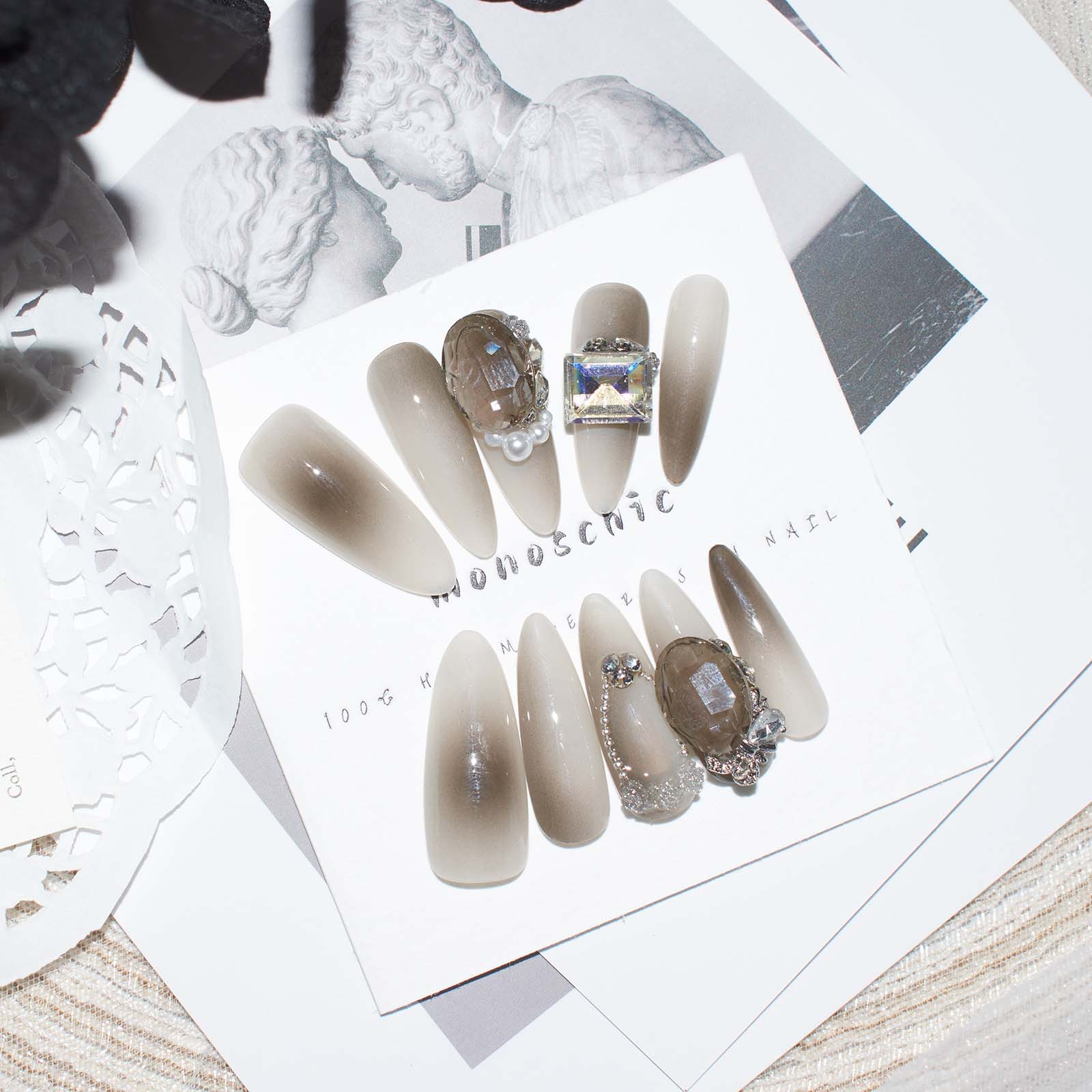 Set of brown ombre almond-shaped press-on nails with 3D pearls and rhinestones, offering a simple yet elegant look